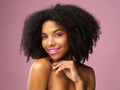 Face, hair care and smile of black woman with makeup in studio isolated on pink background for skincare. Hairstyle
