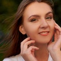 Face of happy beautiful woman with flying hair Royalty Free Stock Photo