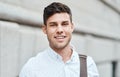 Face of a happy, smiling and professional business man, entrepreneur or employee standing in the city. Portrait headshot Royalty Free Stock Photo