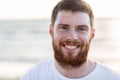 Face of happy smiling young man on beach Royalty Free Stock Photo