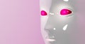 Face of humanoid robot with red eyes made of plastic