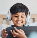 Face of kid, headphones and tablet in home for reading ebook, watch movies and play video game on elearning app. Happy Royalty Free Stock Photo