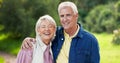 Face, kiss and senior couple in nature, having fun and bonding together. Portrait, happy and elderly man and woman