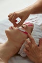 Face Lift Tape. Closeup of face taping procedure for smoothing wrinkles, lifting tightening skin. Rejuvenation, skincare