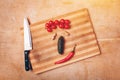 face like composition of fruits and vegetables on chopping board with knife