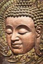 Face of Lord Buddha, native Thai style wood carving Royalty Free Stock Photo