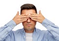 Face of man covering his eyes with hands Royalty Free Stock Photo