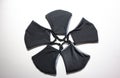 Face mask in black. Five masks to personal wear. White background. It avoids contagious disease