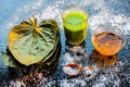 Face mask for controlling oiliness consisting of betel leaves juice, honey, sea-salt on a black wooden surface. Royalty Free Stock Photo