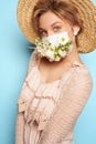 Face mask design with flowers. Portrait of beautiful woman with blue eyes, straw hat and mask Royalty Free Stock Photo