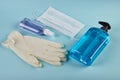 Face mask with hand sanitizer bottle, liquid soap dispenser and latex gloves
