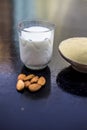 Face mask of multani mitti or mulpani mitti or fuller`s earth in a clay bowl on the wooden surface well mixed with milk and Royalty Free Stock Photo