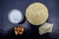 Face mask of multani mitti or mulpani mitti or fuller`s earth in a clay bowl on the wooden surface well mixed with milk and Royalty Free Stock Photo