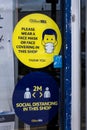 Face mask and social distancing signs outside William Hill bookmakers Runcorn July 2020