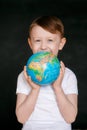 Face of a mask-wearing boy with fear in the eye Close-up on a gray background. Coronavirus and Air pollution concept. COVID-19 Royalty Free Stock Photo