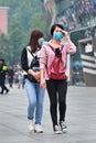 Face masked girl gets dizzy from smog, Beijing, China