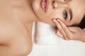 Face massage. Beautiful of young woman getting spa massage treatment at beauty spa salon.Spa skin and body care. Royalty Free Stock Photo