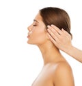 Face Massage. Beauty Model Facial Profile Spa Treatment. Woman Skin and Body Care Cosmetics Salon. Hands massaging Head over White Royalty Free Stock Photo