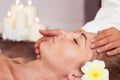 Face Massage. Close-up of a beautiful Woman Getting Spa Treatment. Royalty Free Stock Photo