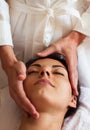 Face Massage. Close-up of a beautiful Woman Getting Spa Treatment. Royalty Free Stock Photo