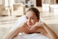 Face massage. Close-up of young woman getting spa massage treatment at beauty spa salon. Royalty Free Stock Photo