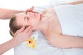 Face massage. Close-up of young woman getting spa massage treatment at beauty spa salon.Spa skin and body care. Facial beauty Royalty Free Stock Photo