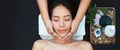 Face massage. Close-up of young woman getting spa massage treatment at beauty spa salon. Spa skin and body care. Facial beauty Royalty Free Stock Photo