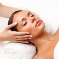 Face Massage. Close-up of a Young Woman Getting Spa Treatment.