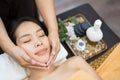 Face massage. Close-up of young woman getting spa massage treatment at beauty spa salon. Spa skin and body care. Facial beauty Royalty Free Stock Photo