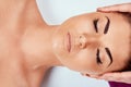 Face massage. Close-up of young woman getting spa massage treatment at beauty spa salon Royalty Free Stock Photo