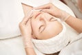 Face massage at luxury spa salon. Cottom pad. Remove mascara. Doctor hands Royalty Free Stock Photo