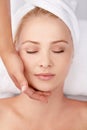 Face, massage and woman at a spa with hands of masseuse for lymphatic drainage procedure from above. Zen, peace and Royalty Free Stock Photo