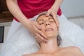 Face massage. Young woman getting spa massage treatment at beauty spa salon. Skin and body care. Facial beauty treatment Royalty Free Stock Photo