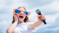 Face the music happy childhood. happy girl enjoy the moment. Have Fun on Celebration. teen kid singing with microphone Royalty Free Stock Photo