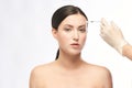 Face needle injection. Young woman cosmetology procedure. Doctor gloves