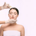 Face needle injection. Young woman cosmetology procedure. Doctor gloves Royalty Free Stock Photo