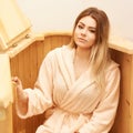 Barrel cedar. Wellness spa sauna. Aromatherapy treatment. Young beauty woman. Girl face