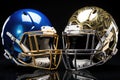 Face-off ready football helmets, reflecting the lights of the game night. Royalty Free Stock Photo