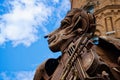 Face of an old rusty statue with iron violin