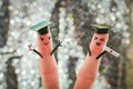 Face painted on the fingers. students holding their diploma after graduation Royalty Free Stock Photo