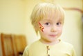 Face painting for cute little boy during kids merriment Royalty Free Stock Photo