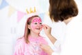 Face painting for little girl birthday party Royalty Free Stock Photo