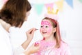 Face painting for little girl birthday party Royalty Free Stock Photo