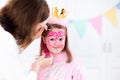 Face painting for little girl birthday party Royalty Free Stock Photo