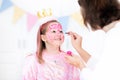 Face painting for little girl birthday party Royalty Free Stock Photo