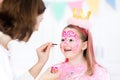 Face painting for little girl birthday party Royalty Free Stock Photo