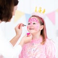 Face painting for little girl birthday party Royalty Free Stock Photo