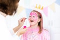 Face painting for little girl birthday party Royalty Free Stock Photo