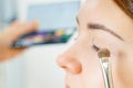 Makeup artist applying eye make up Royalty Free Stock Photo