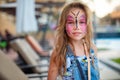 Face painting pink butterfly on little girl Royalty Free Stock Photo